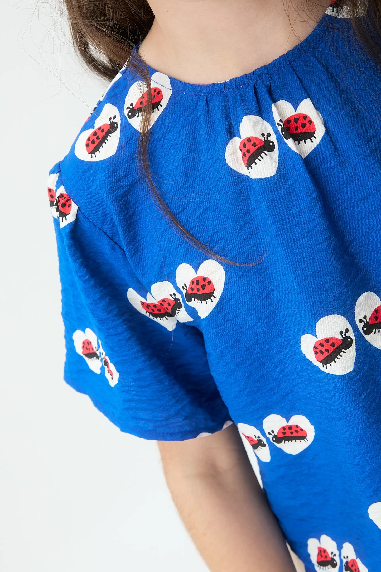 Top da bambina con stampa coccinella