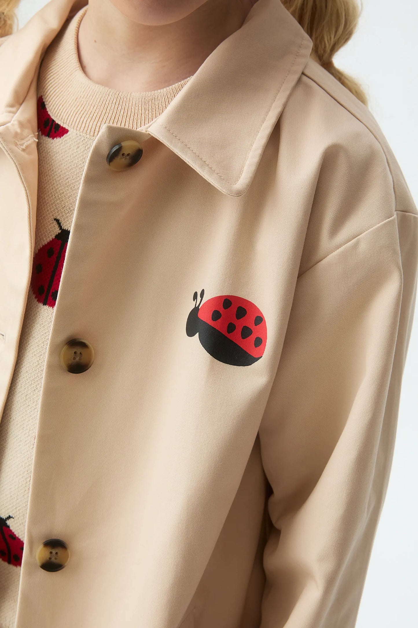 Girl's trench coat with ladybug print