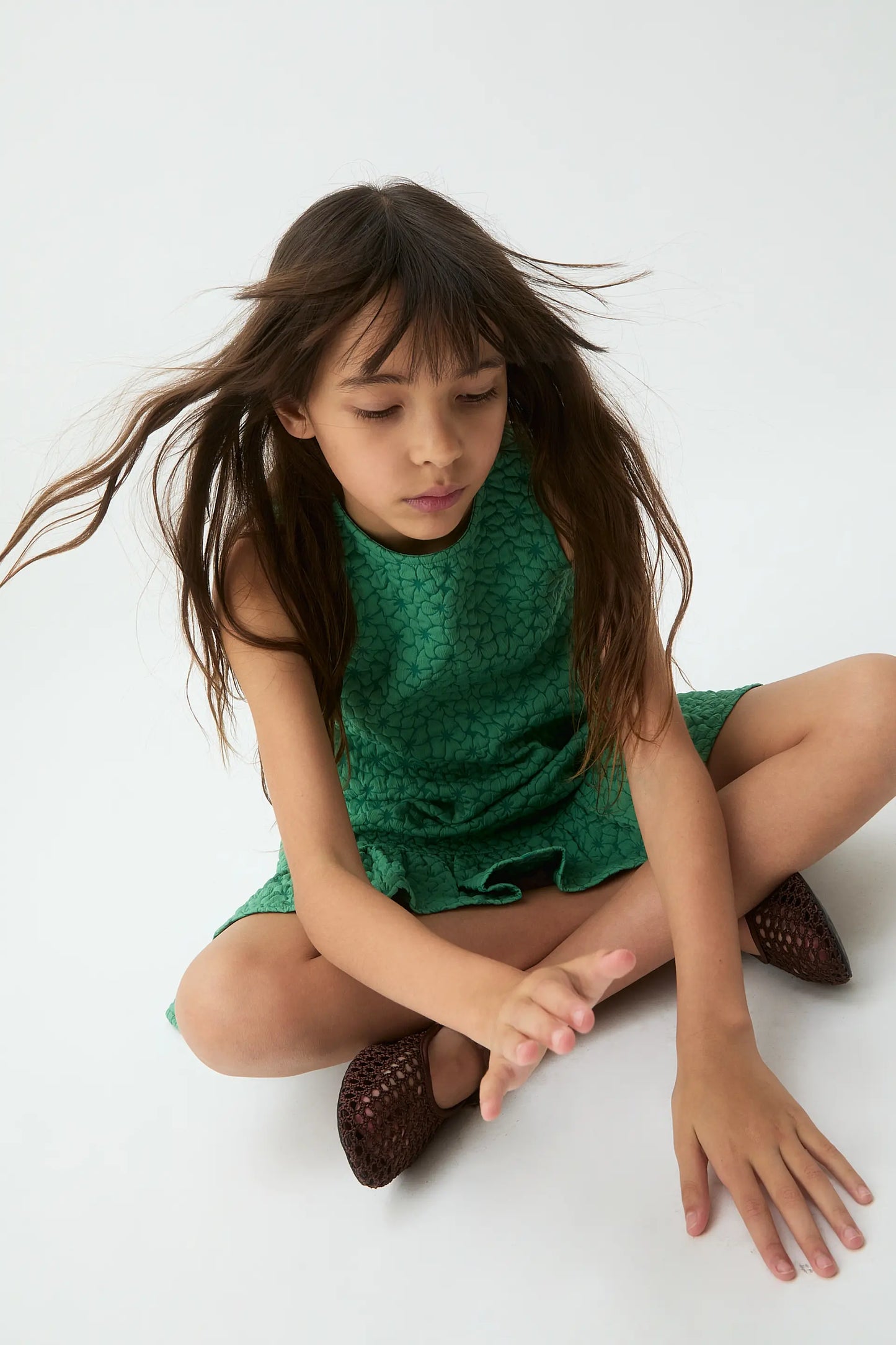 Short girl's dress with green floral print