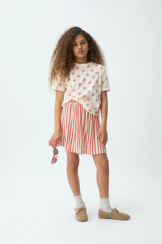 Falda corta de niña con estampado de rayas rojas