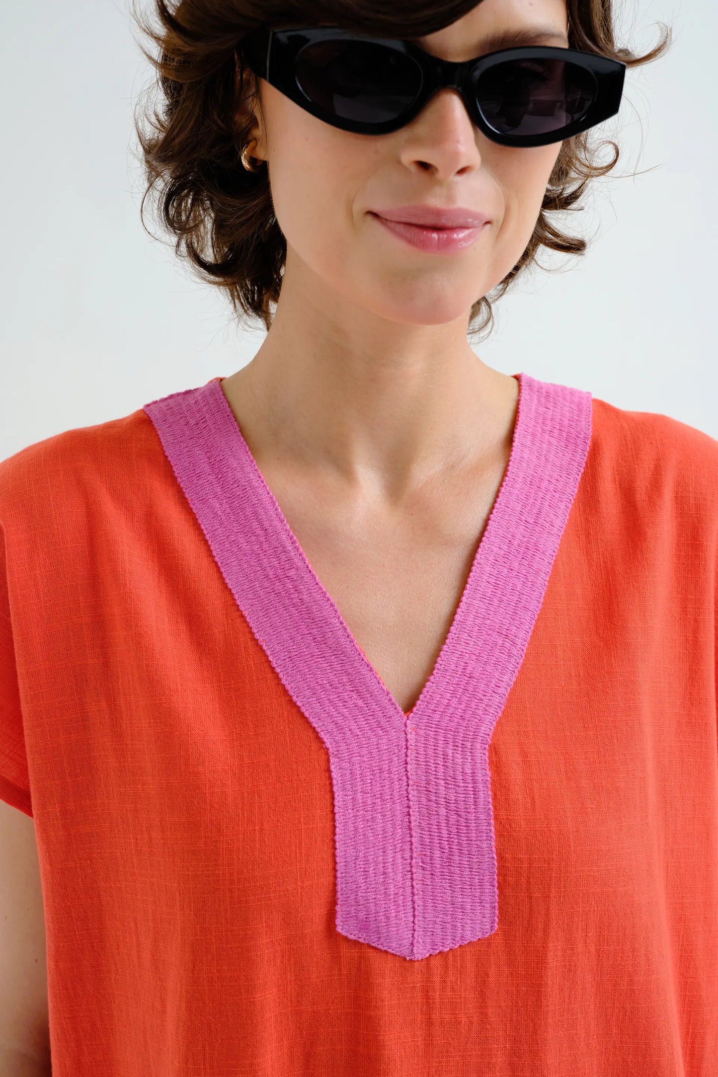 Long orange kaftan with pink neckline