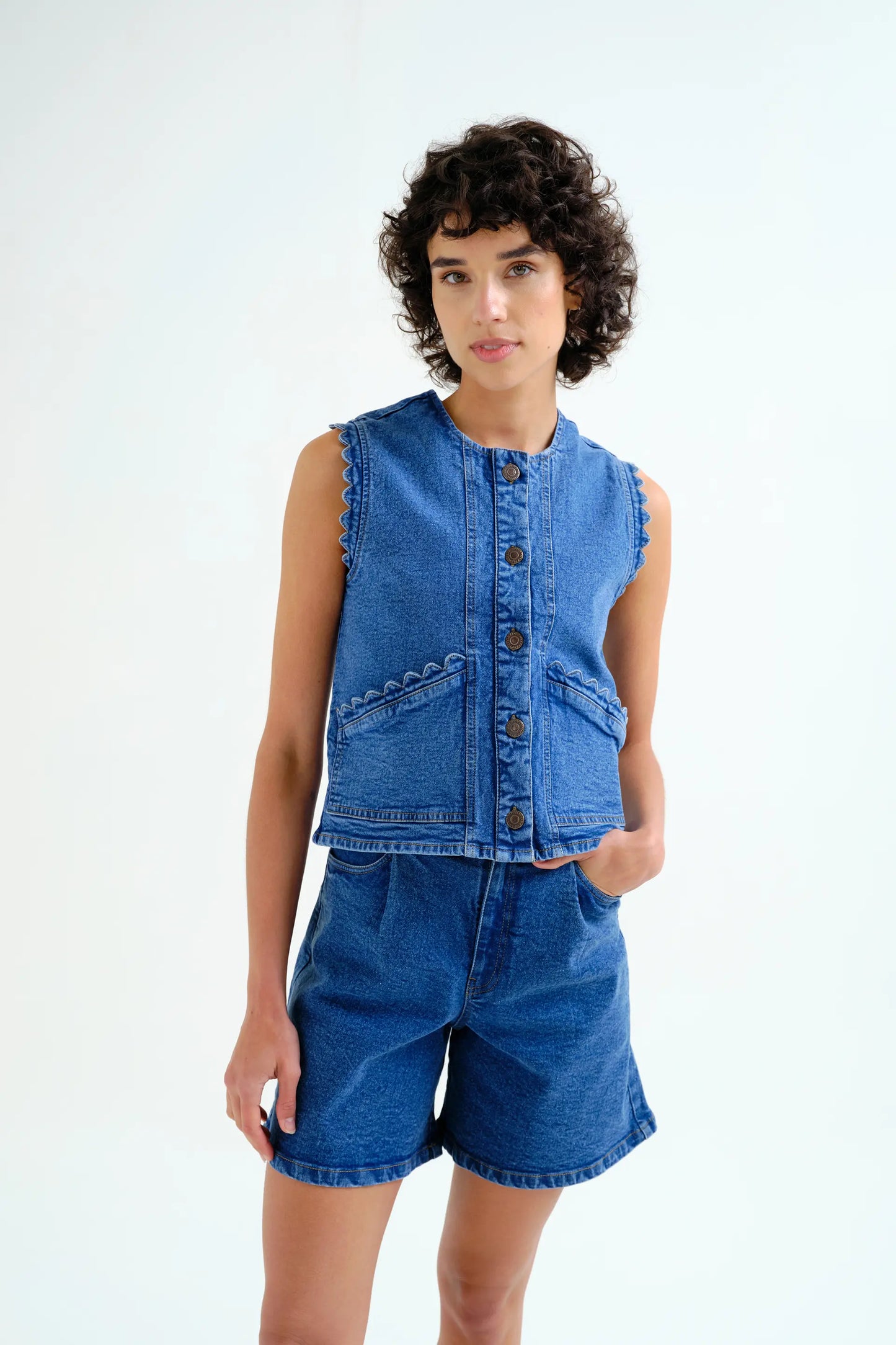Blue denim vest with wavy detail