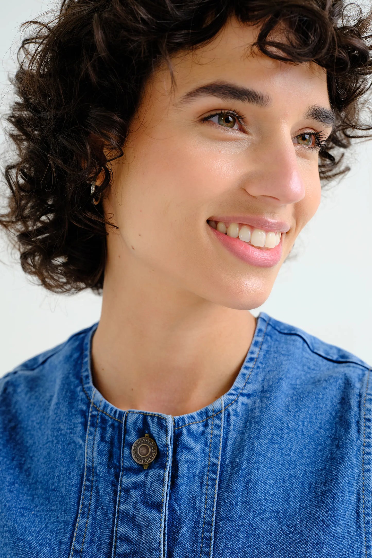 Blue denim vest with wavy detail