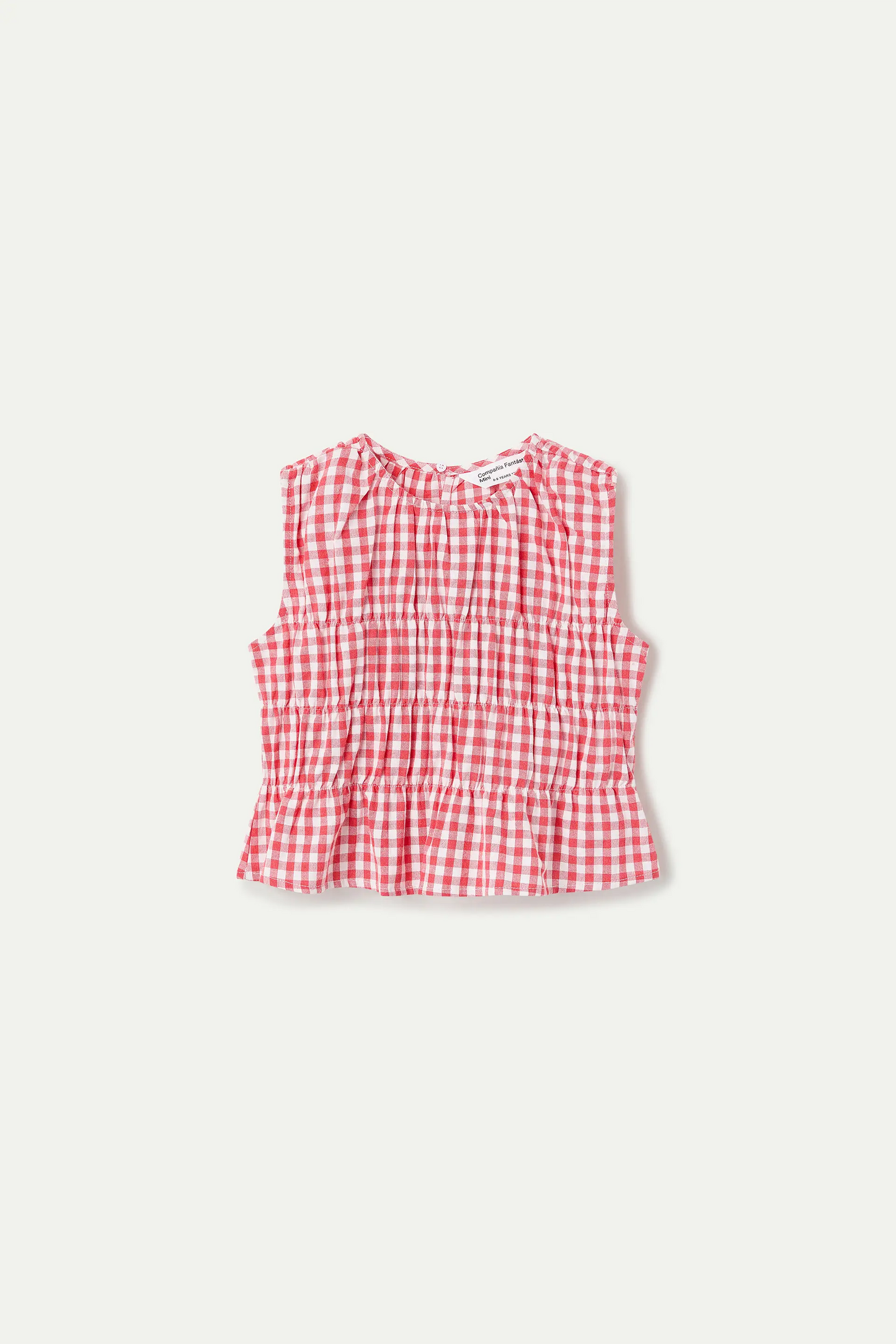 Girl's top with red gingham print