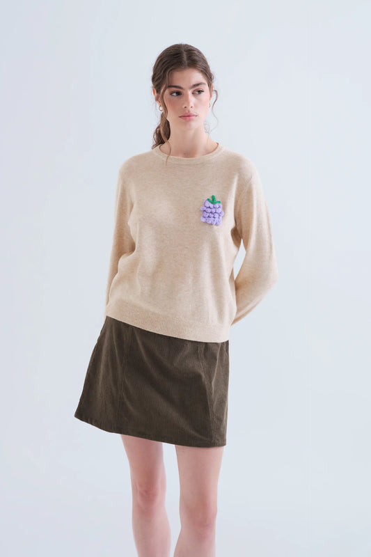 Beige knit jumper with grape detail