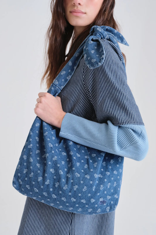 Blue denim shoulder bag with heart print