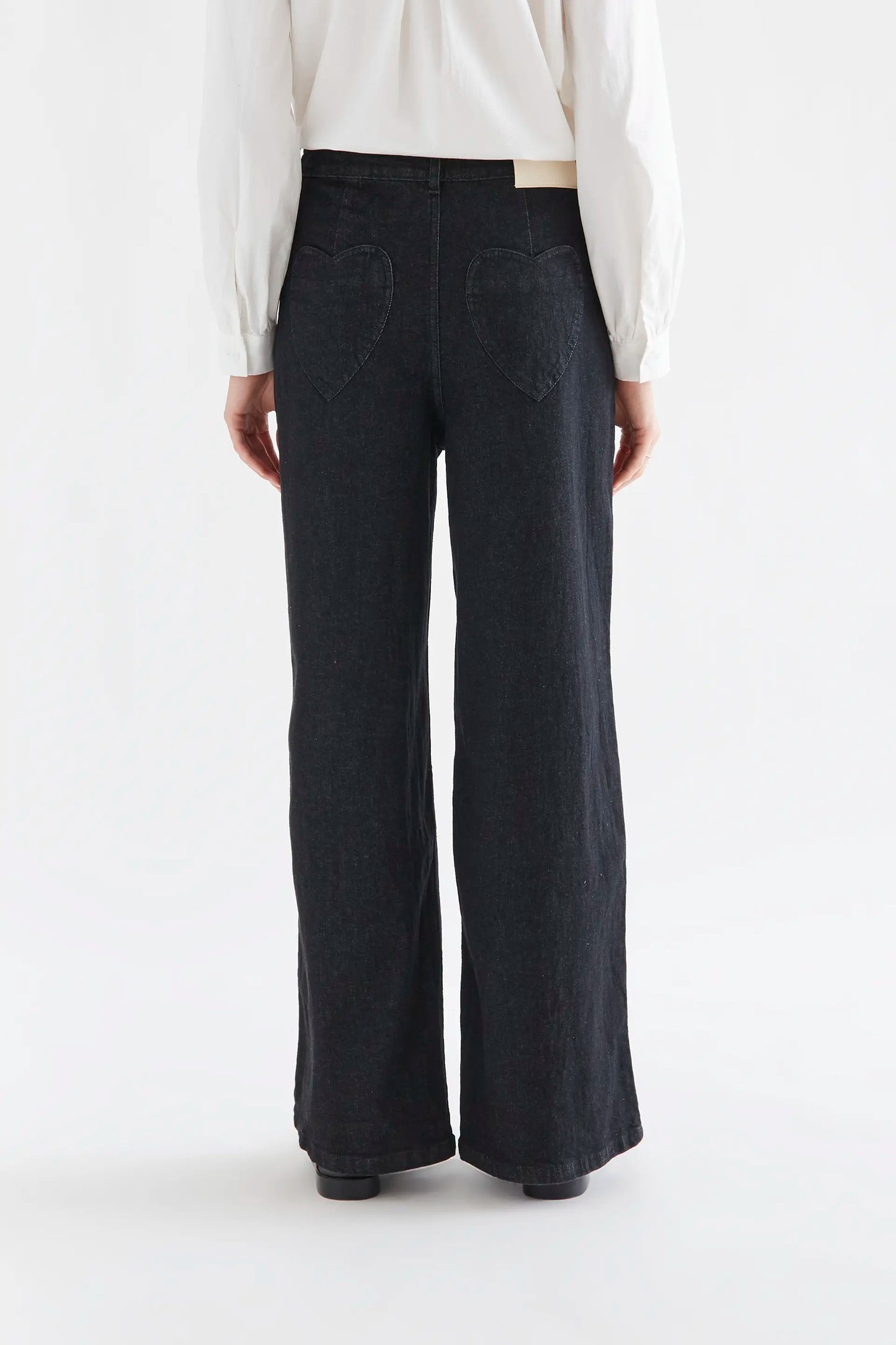 Black denim pants with heart pockets