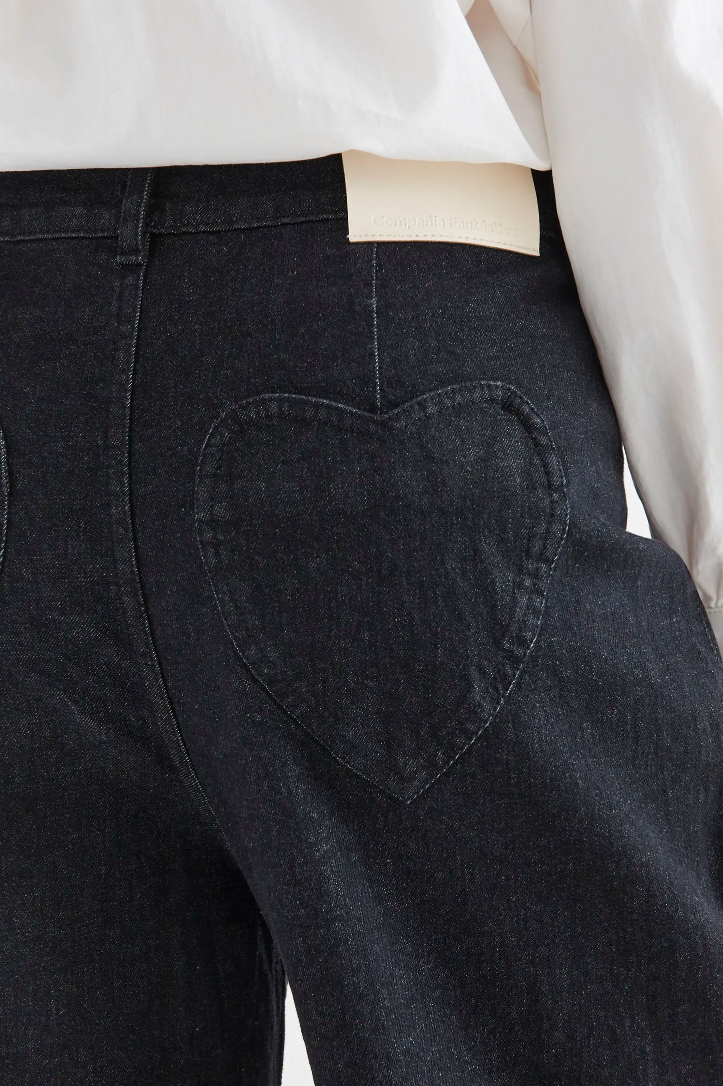 Black denim pants with heart pockets
