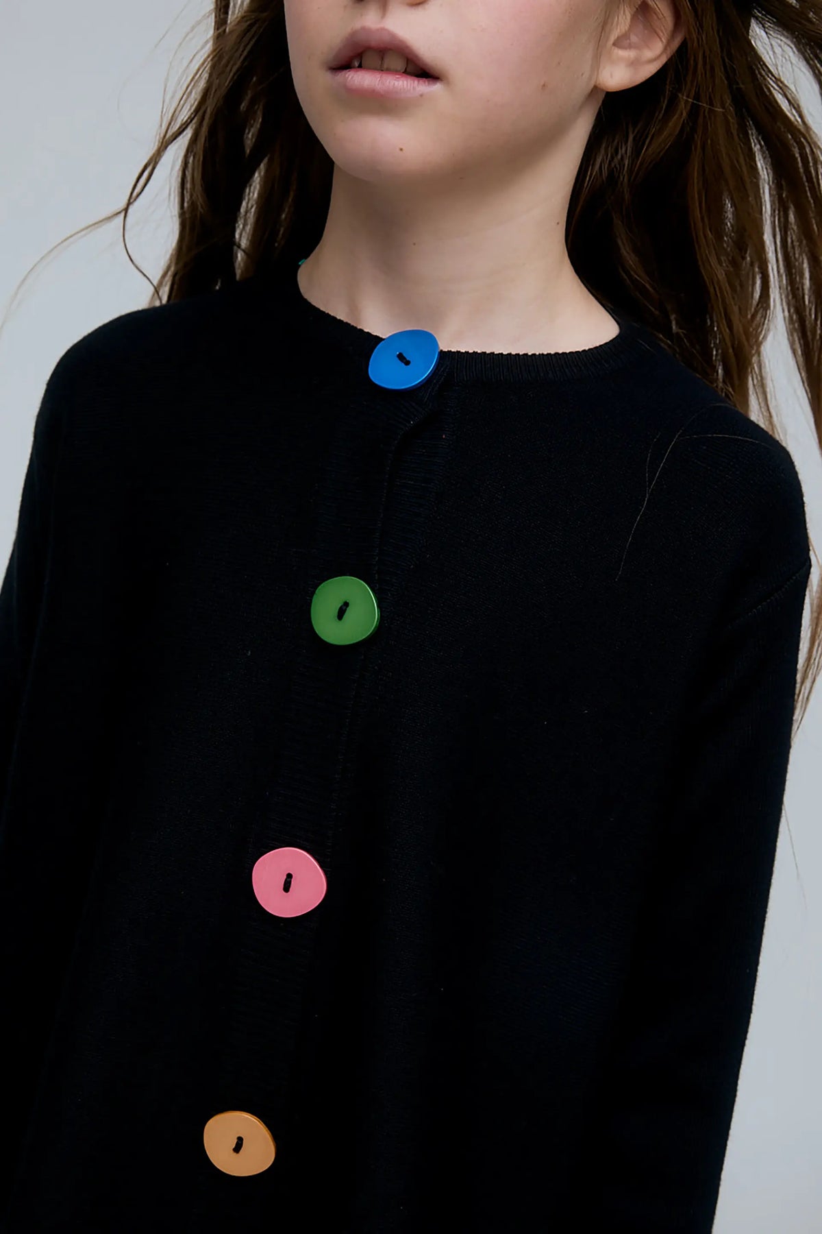 Girl's black cardigan with multicolored buttons