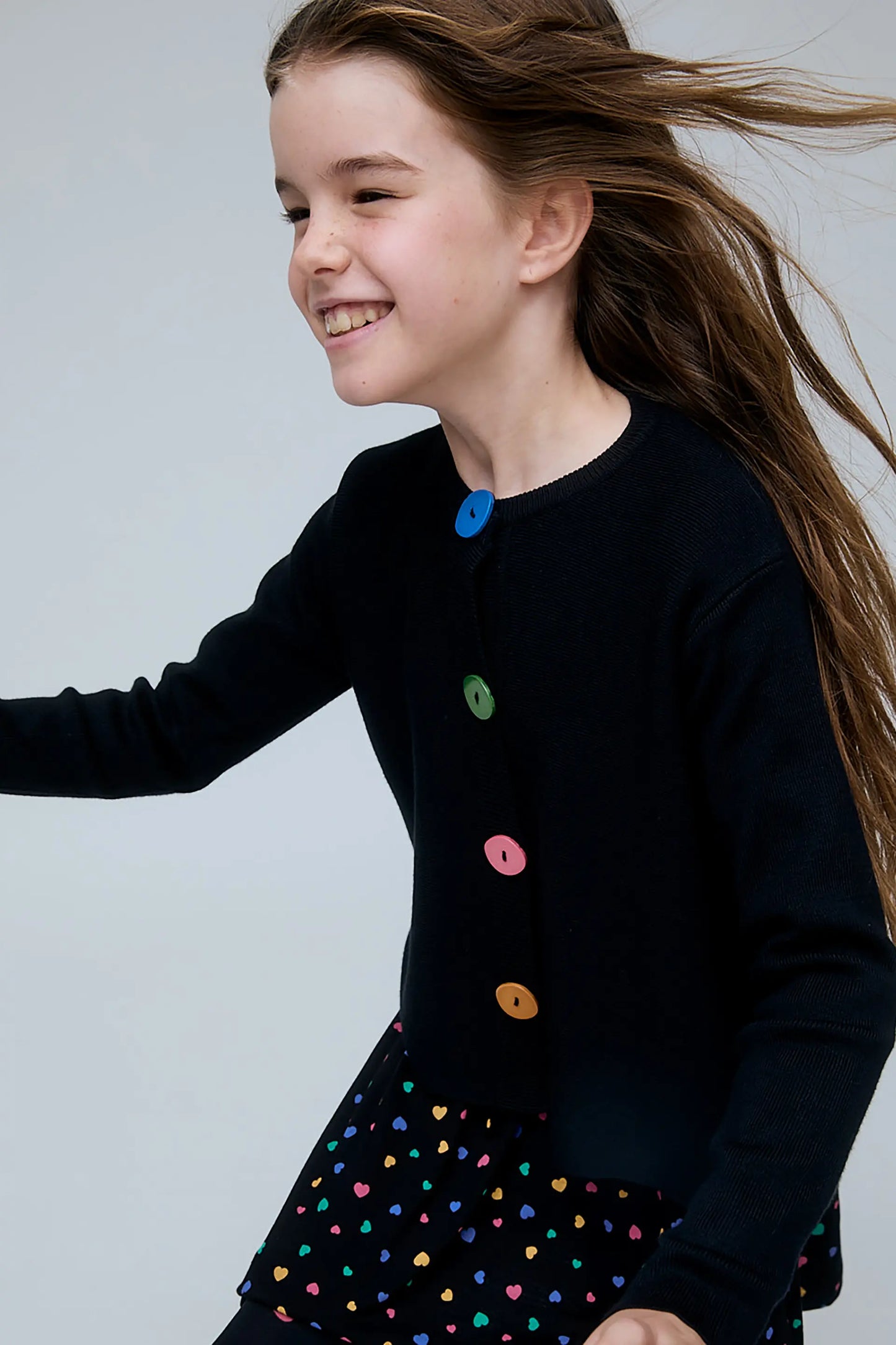Girl's black cardigan with multicolored buttons