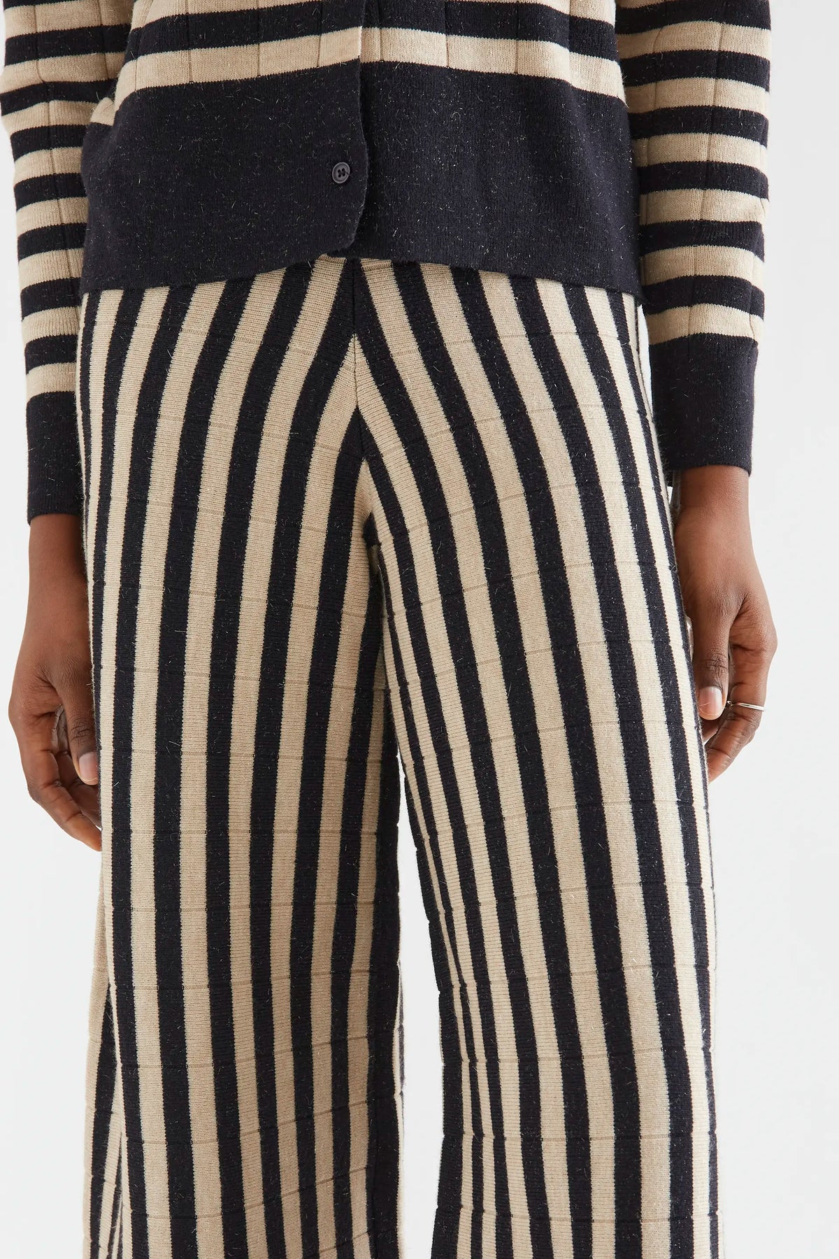 Knitted trousers with black and beige stripe print