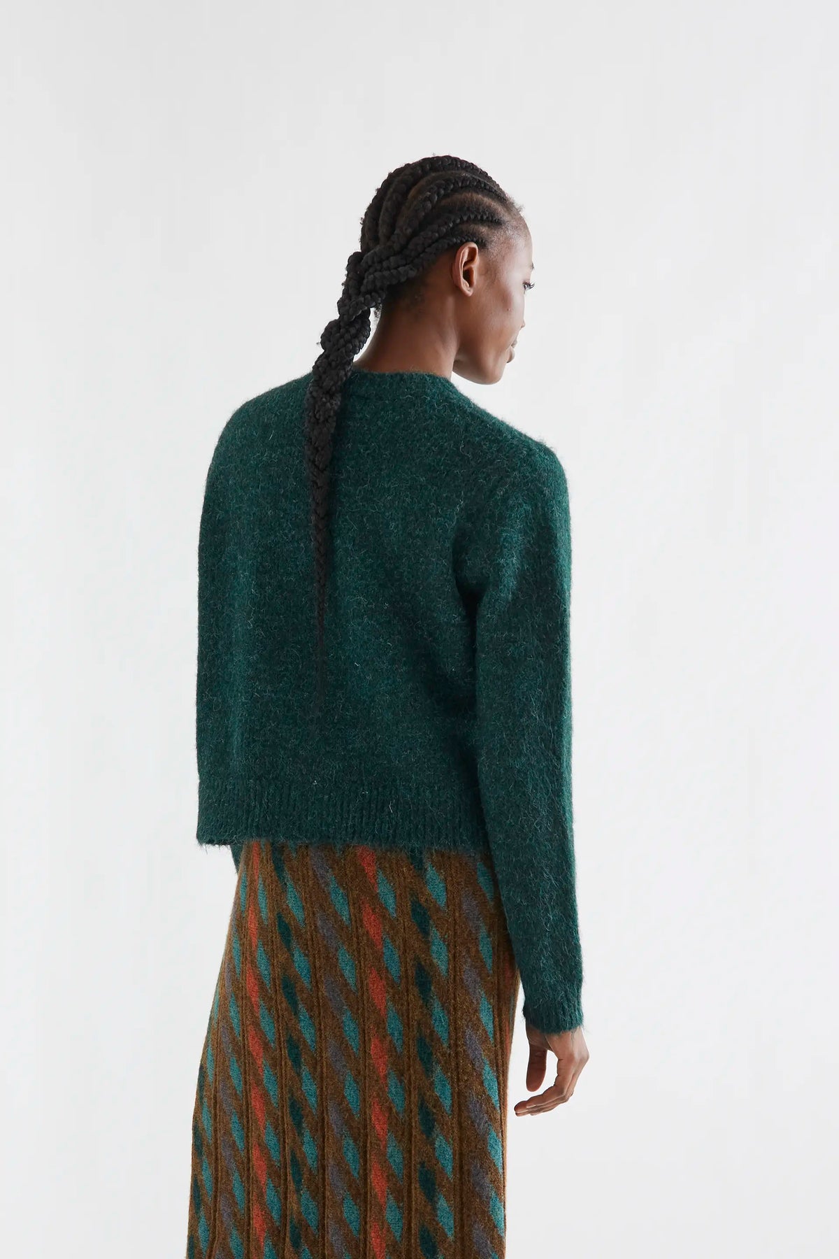 Dark green knit cardigan with light green buttons