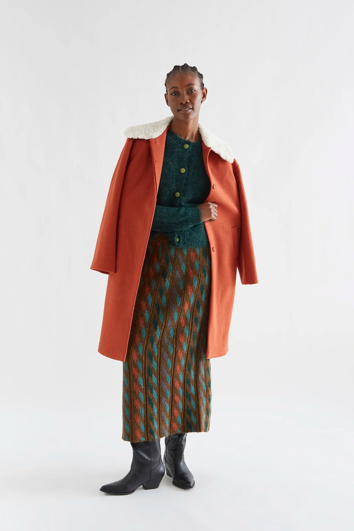 Dark green knit cardigan with light green buttons