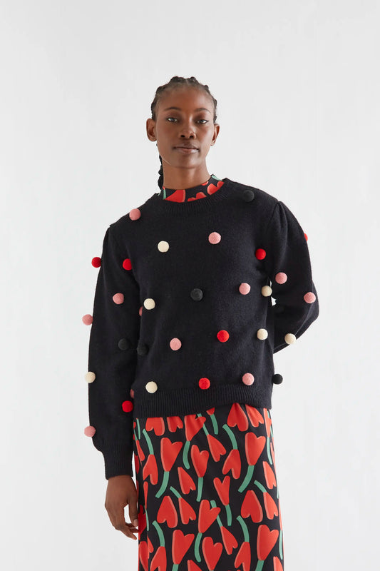 Maglione nero con pon pon multicolor