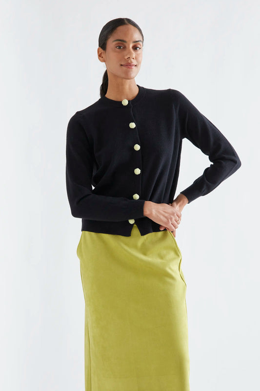 Black cardigan with white pompoms