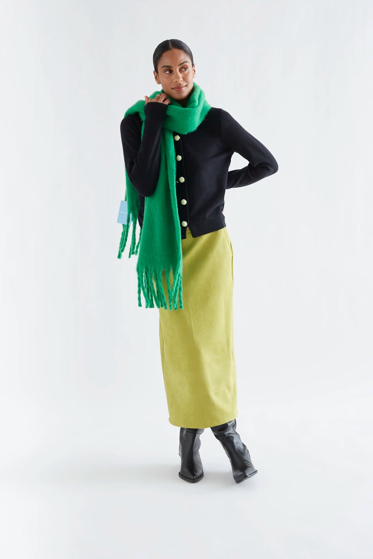 Black cardigan with white pompoms