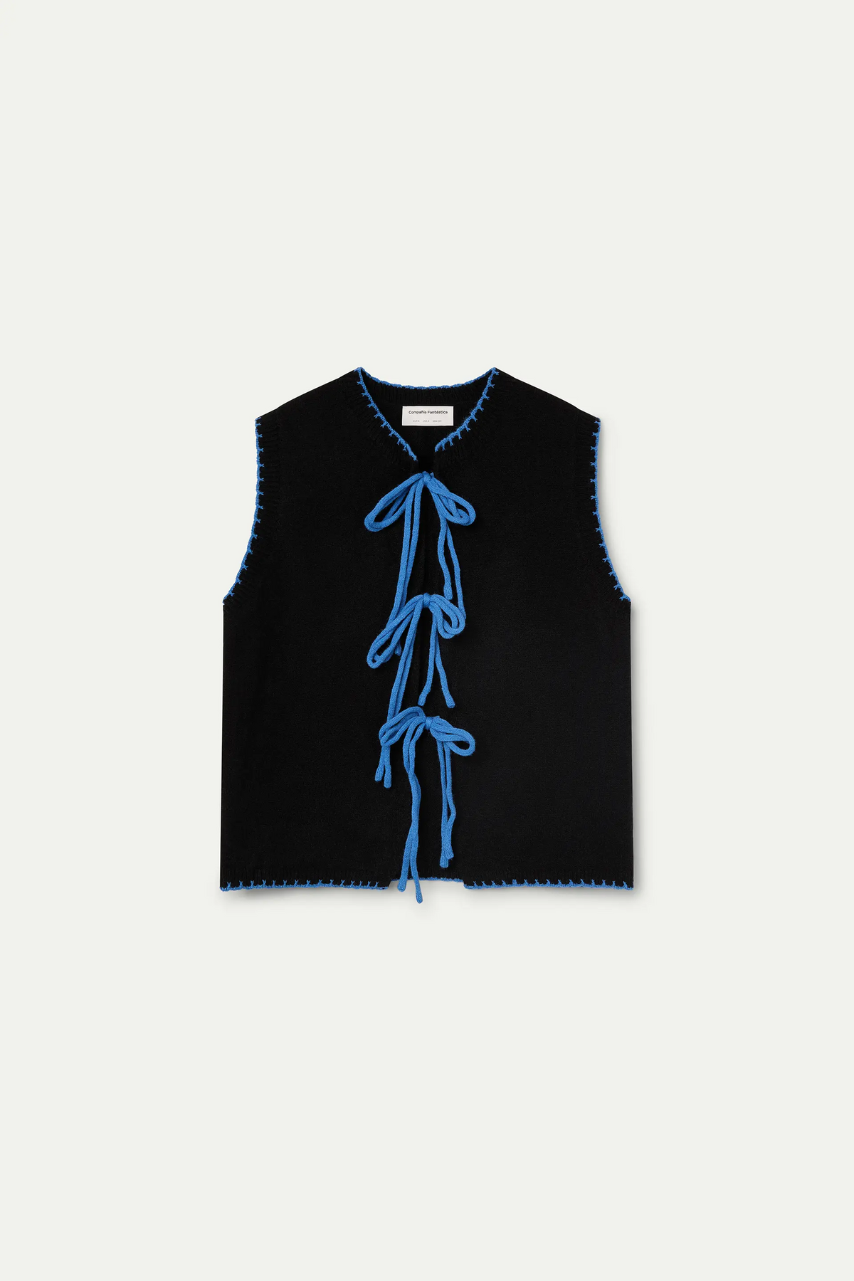 Black knit vest with light blue lace-up detail