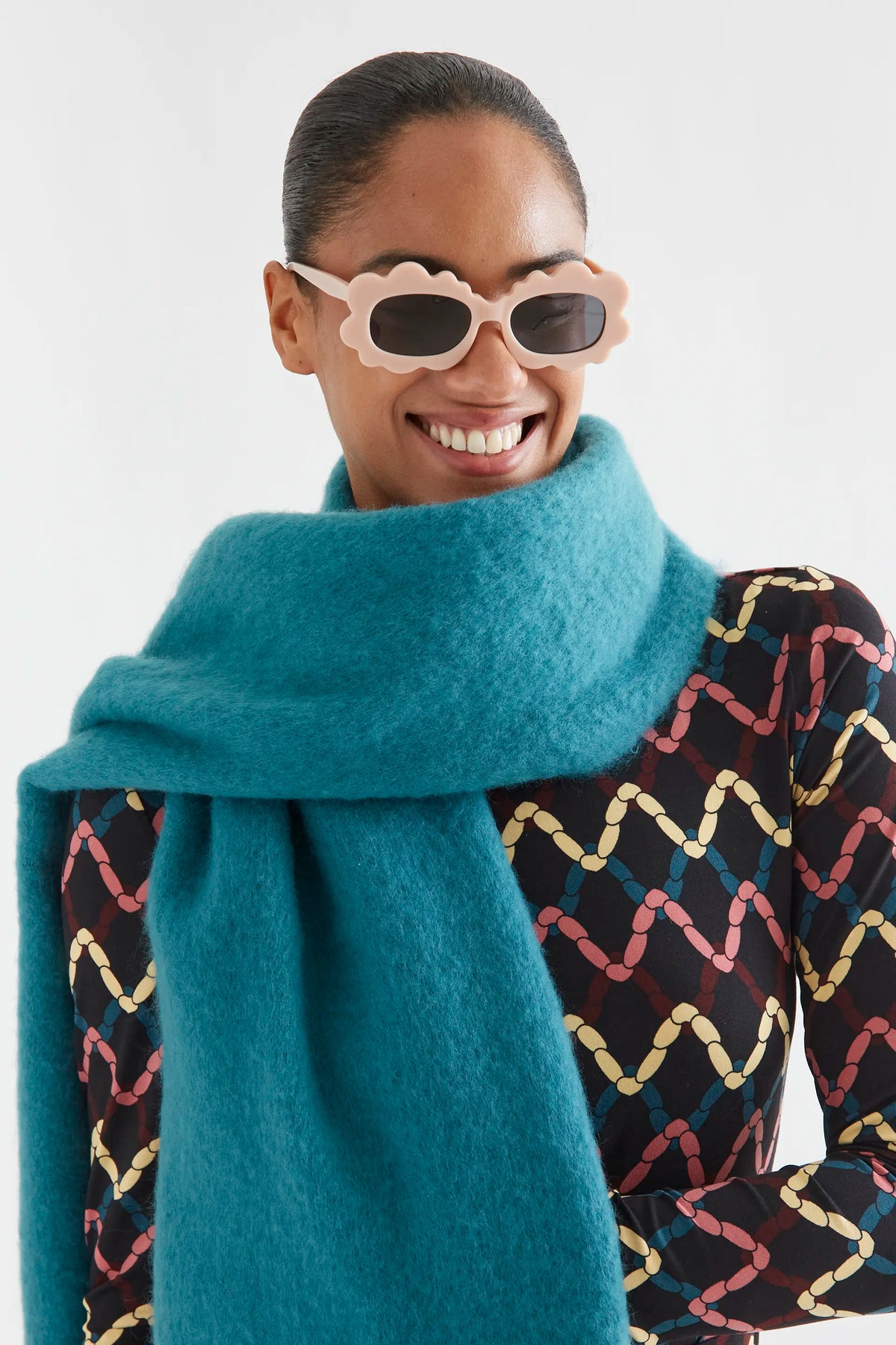 Dark green knitted scarf with fringe