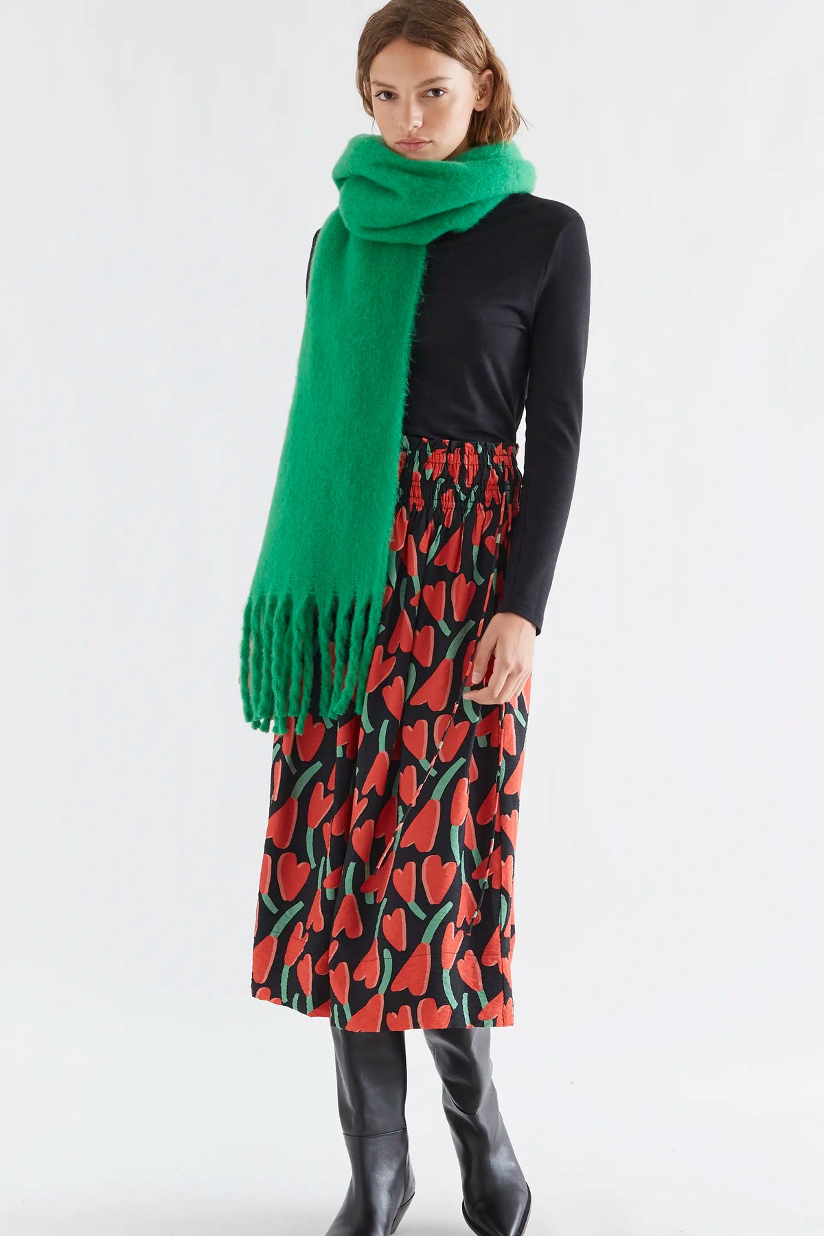 Green knitted scarf with fringes
