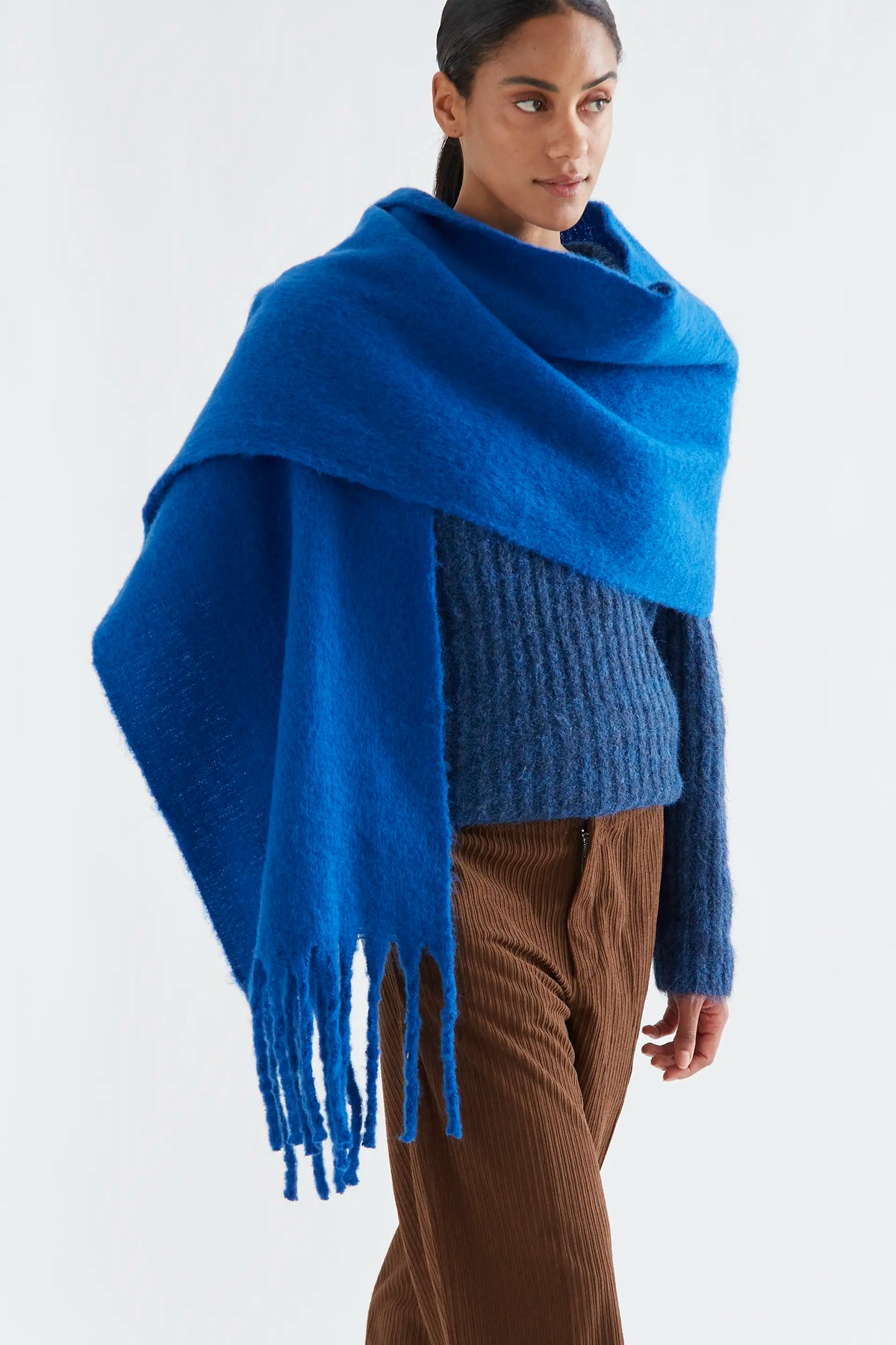 Blue knitted scarf with fringes