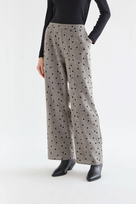 Gray tweed trousers with black embroidered flowers
