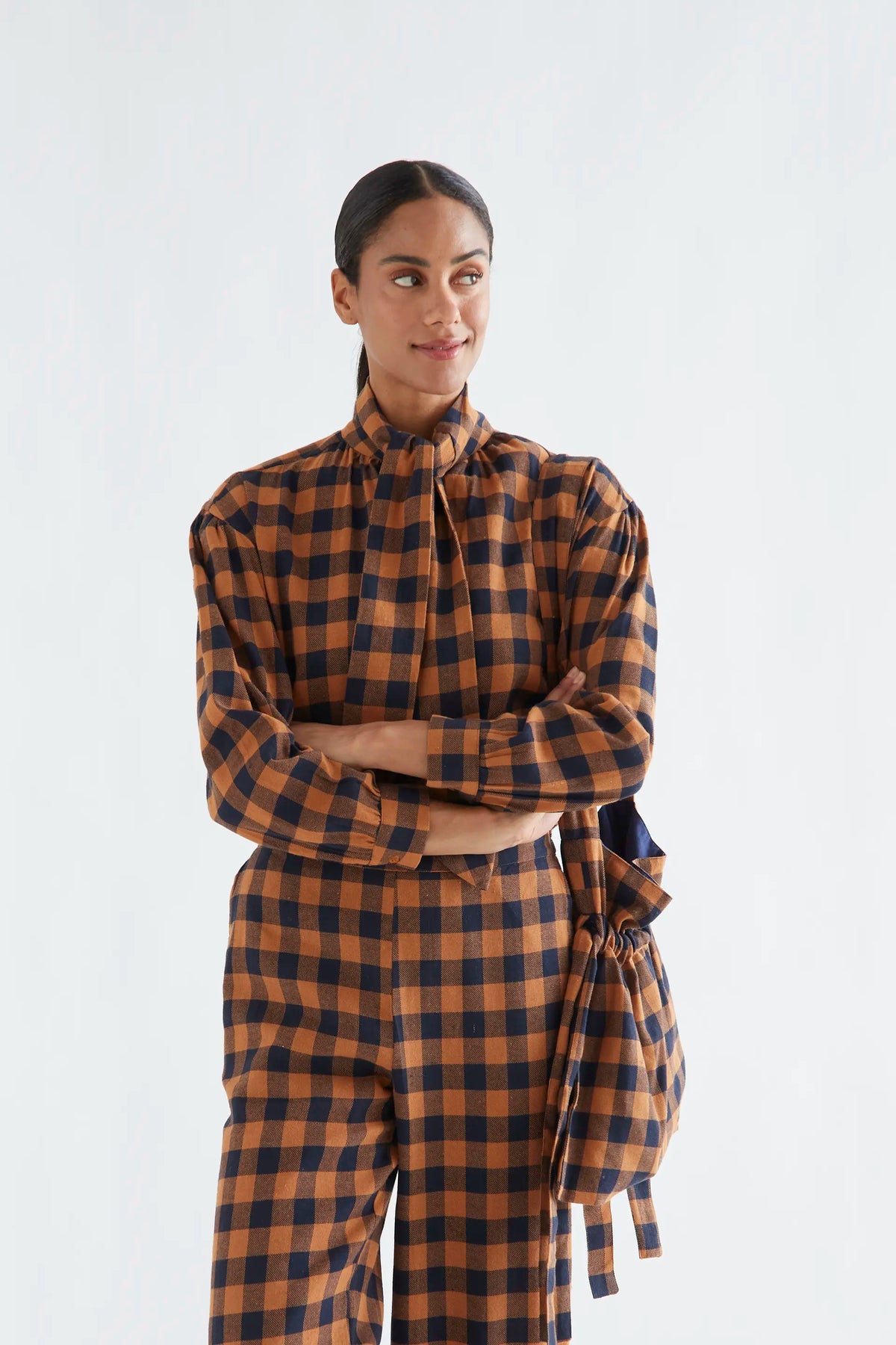 100% cotton pants with a brown and navy plaid pattern