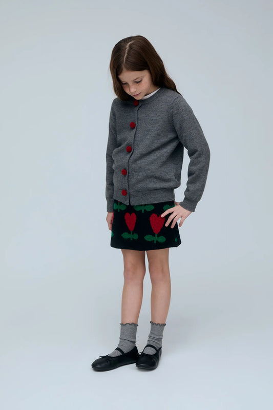 Cárdigan negro de niña gris con botones de pompones