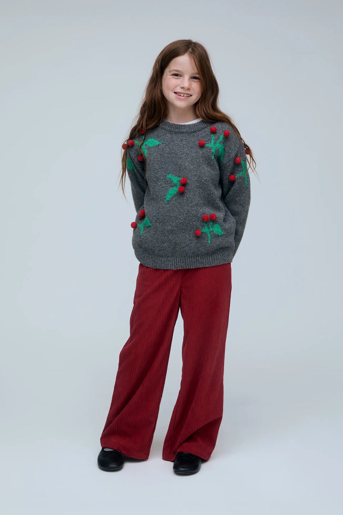 Girls' sweater with Christmas mistletoe detail