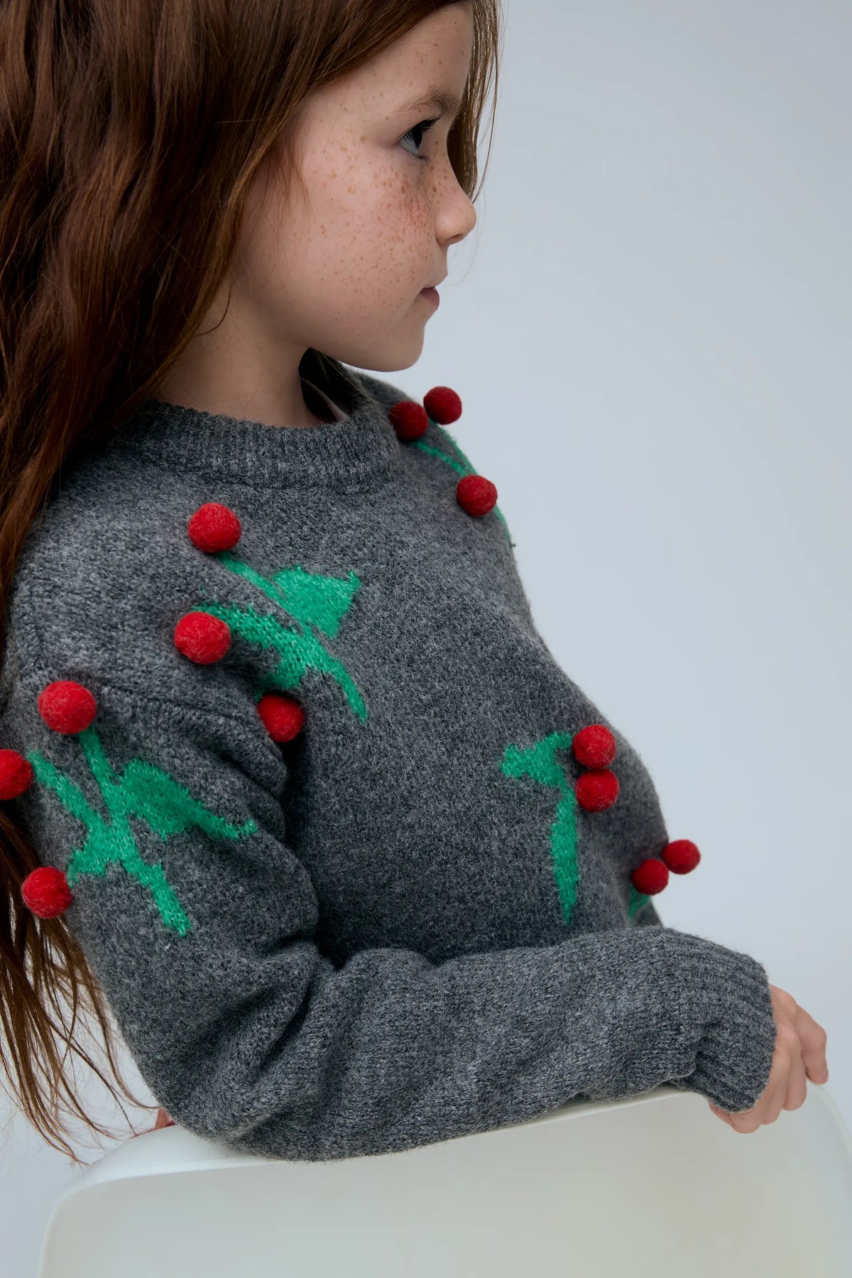 Girls' sweater with Christmas mistletoe detail